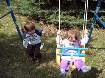 Both kids having a ball in the backyard