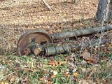 Old oil or gas era pulley on access trail